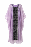 Lilac kimono-style garment over a black and white patterned dress on a white background
