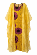 Yellow kaftan
 with pink circular patterns and a sheer overlay on a white background