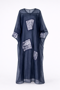 Navy blue kaftan with white patterned patches on a white background