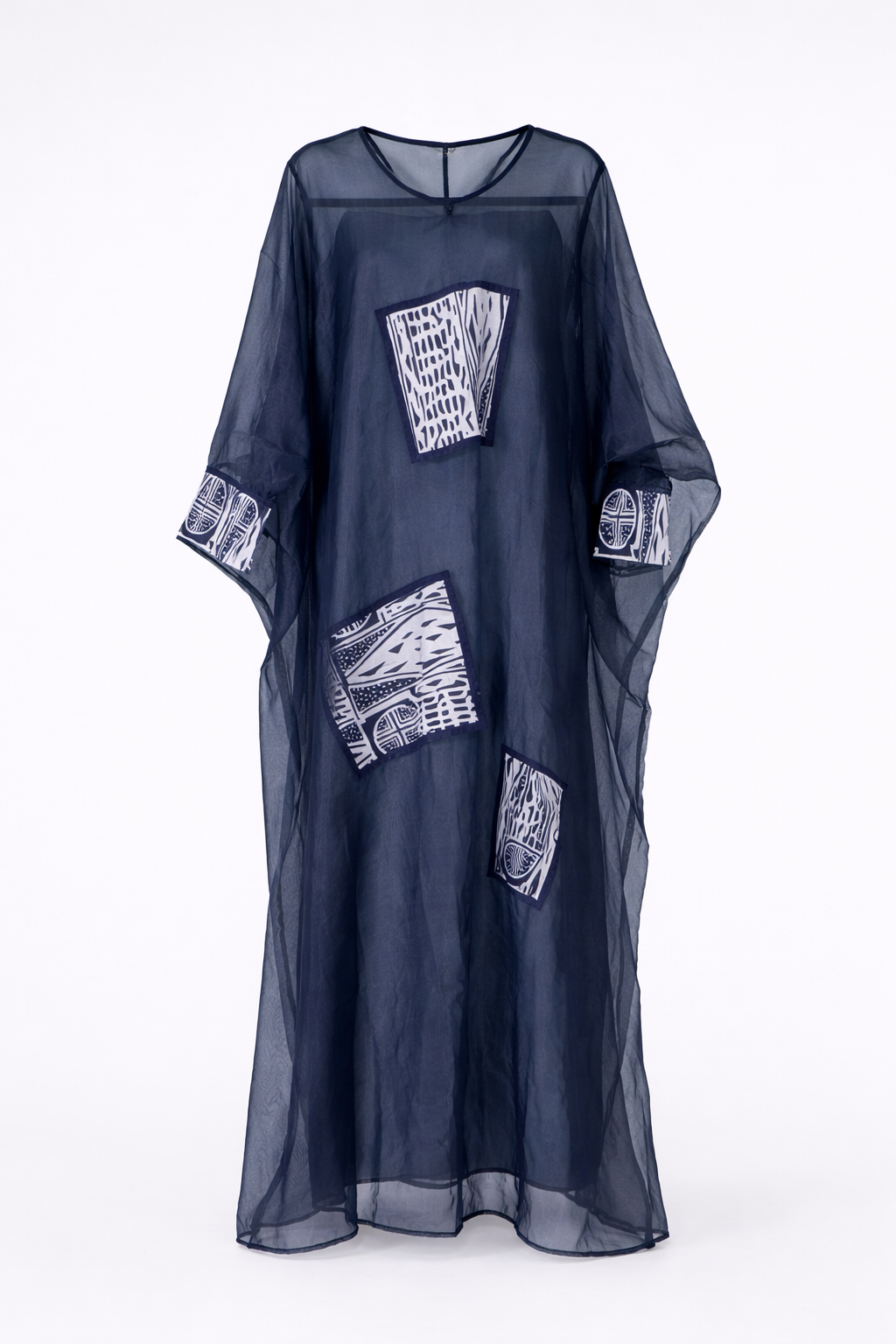 Navy blue kaftan with white patterned patches on a white background