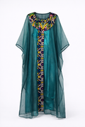 Teal kaftan with colorful geometric pattern on a white background