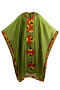 Green garment with colorful geometric patterns on a white background