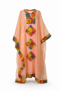 Peach-colored kaftan with colorful geometric patterns on a white background