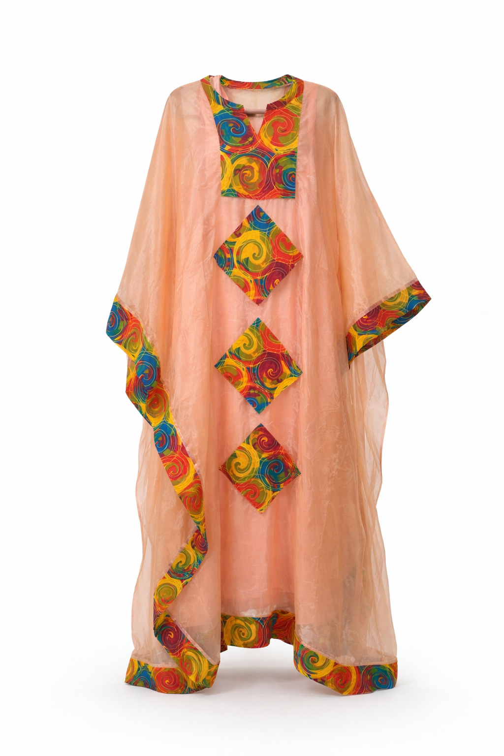 Peach-colored kaftan with colorful geometric patterns on a white background